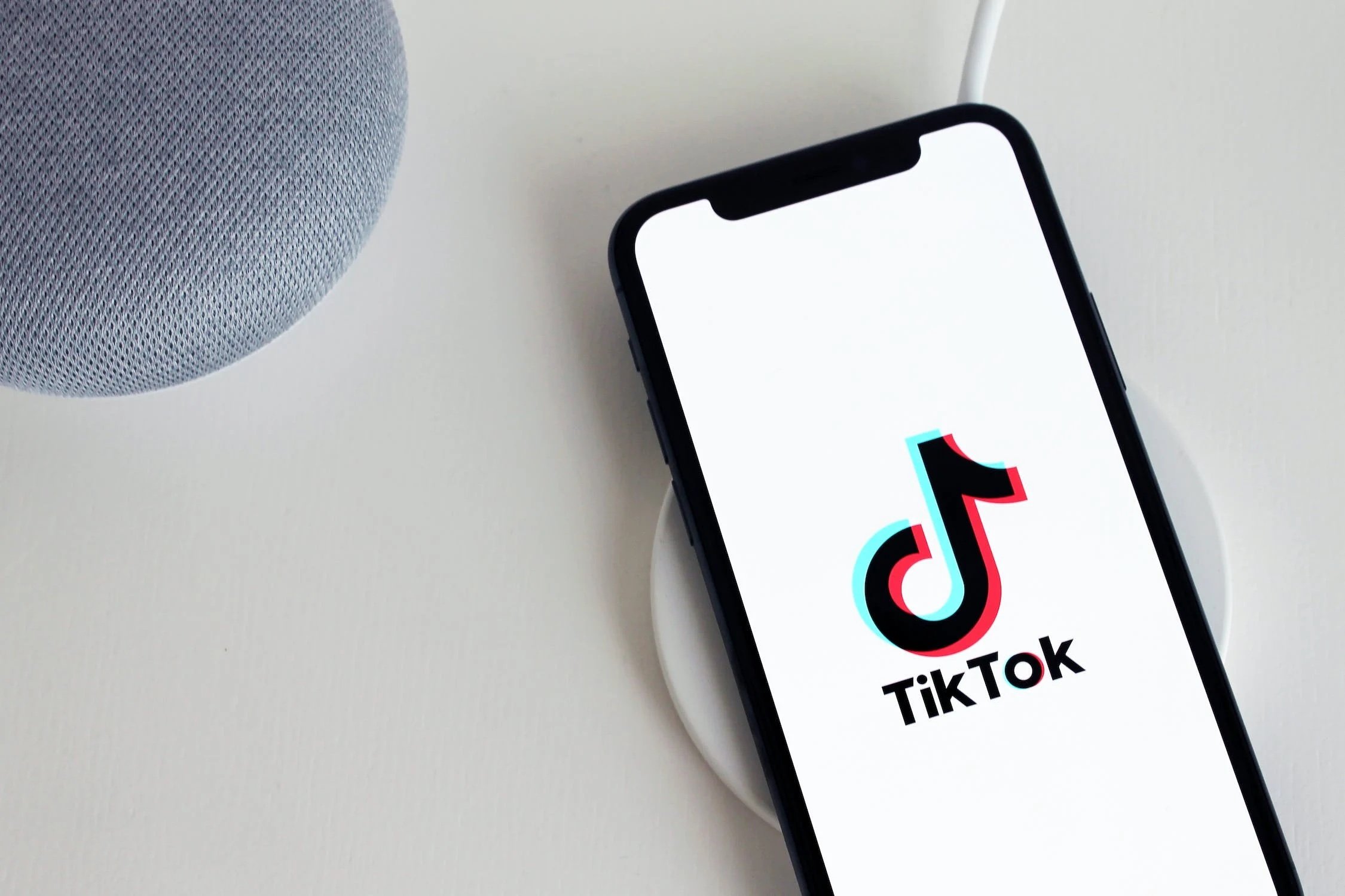A Cellphone with Logo on the Screen, Adapting to Online Trends: Writing Content for TikTok and Shorts