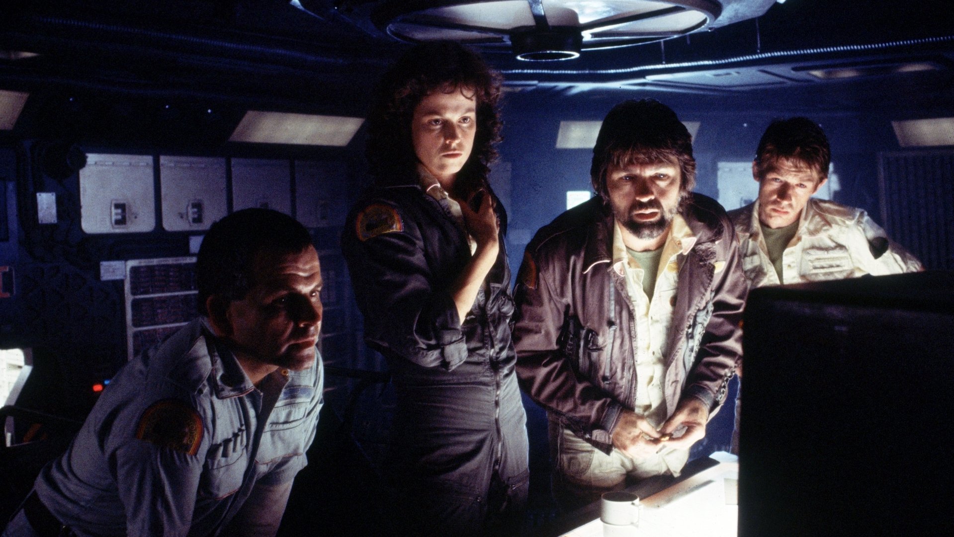 The crew reading something on a computer in 'Alien'