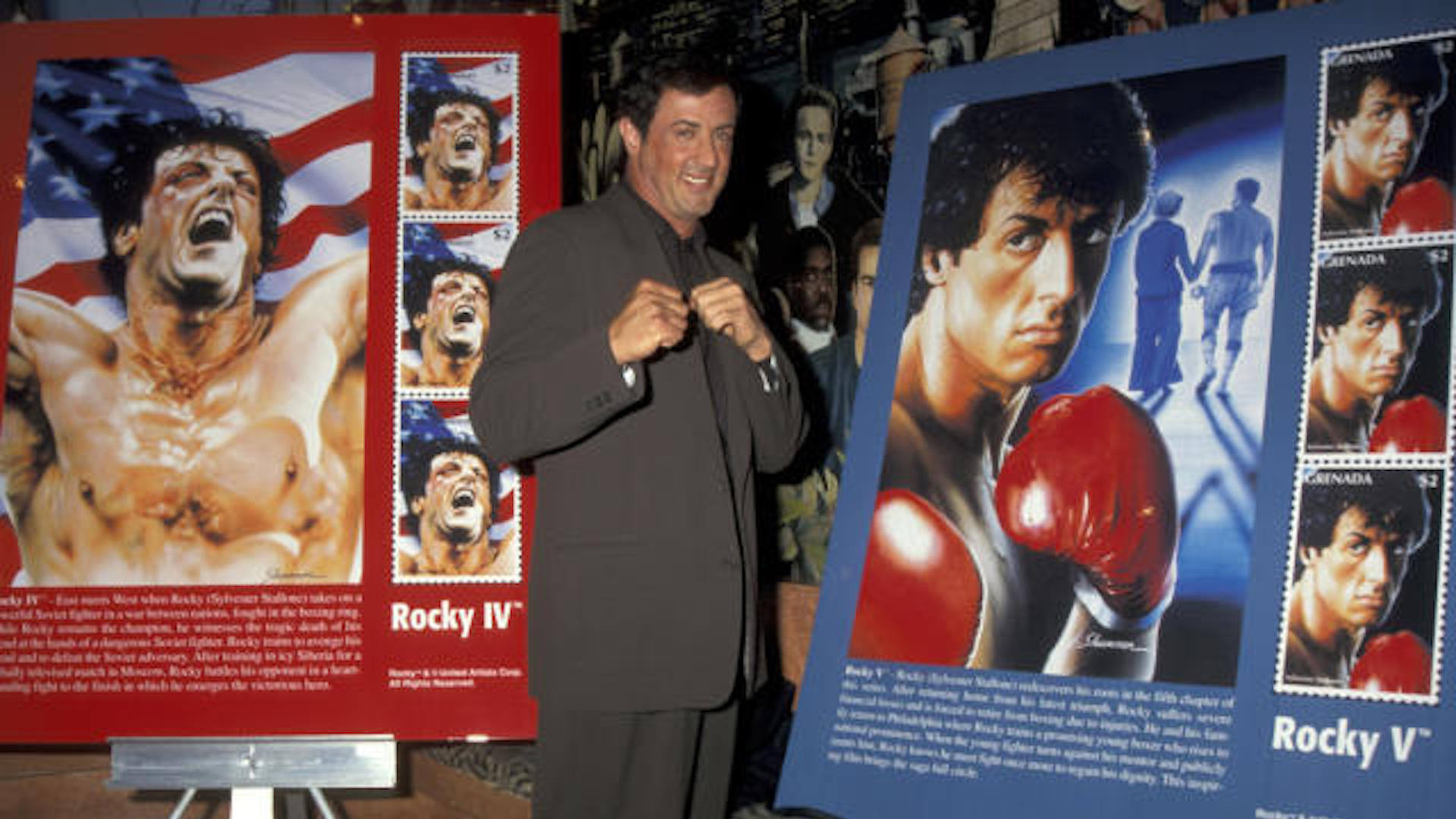 Sylvester Stallone standing in front of two movie posters in 'I Play Rocky'