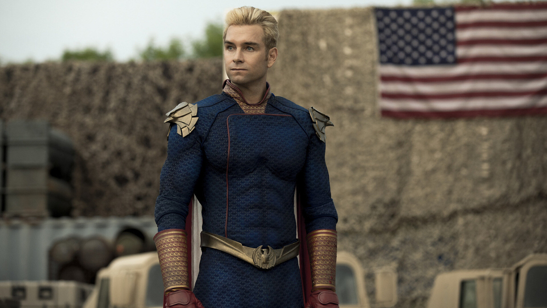 Homelander (Antony Starr) standing in front of an American flag in 'The Boys'
